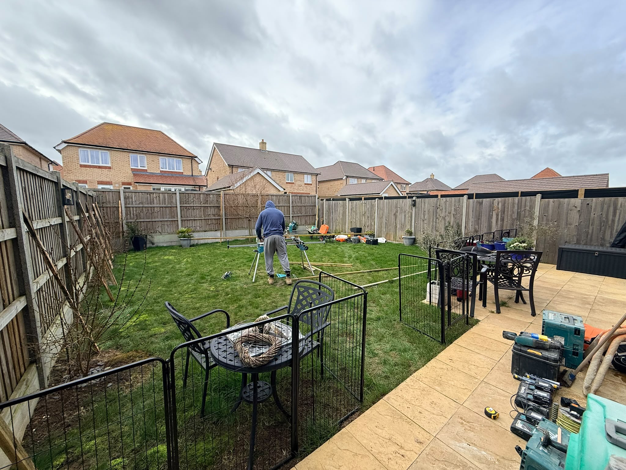 Before: Plain garden with tired lawn and old fence line on the Redrow estate, Witham