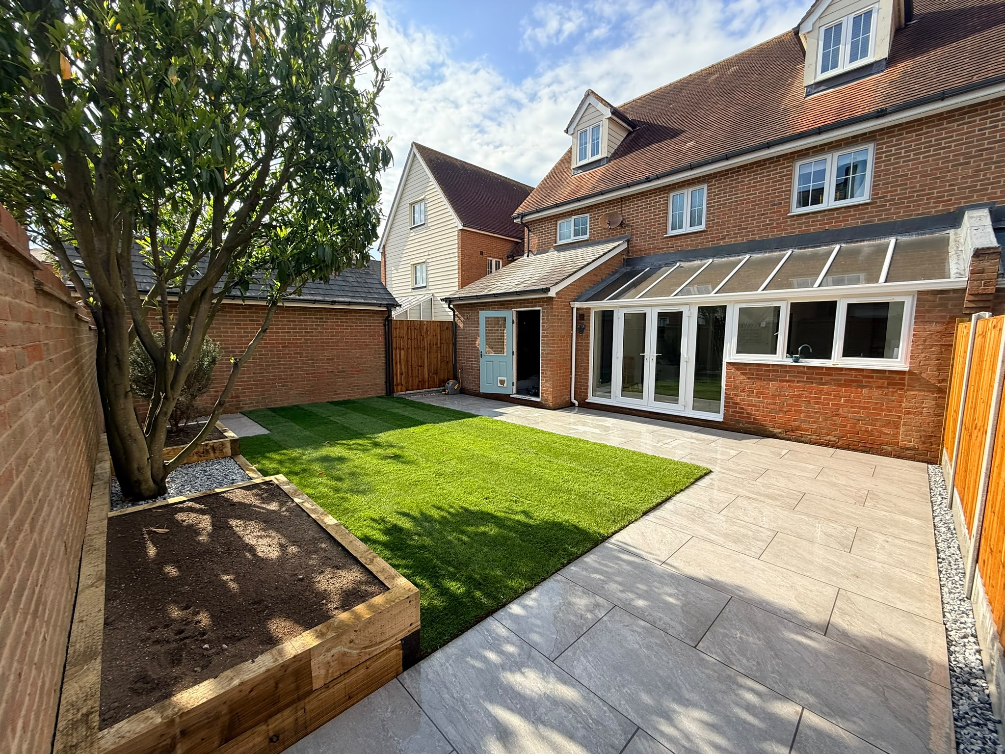 New turf and patio beside the house on Purcell Road, Witham