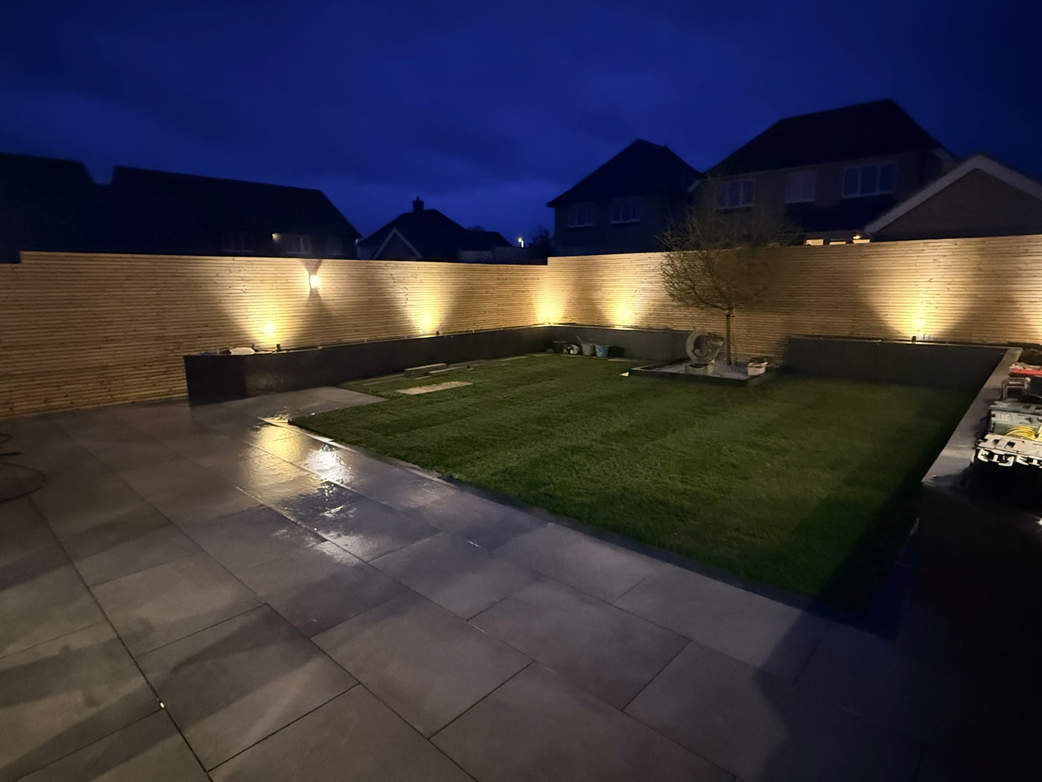 Modern garden retreat with integrated lighting at dusk on the Redrow estate, Witham